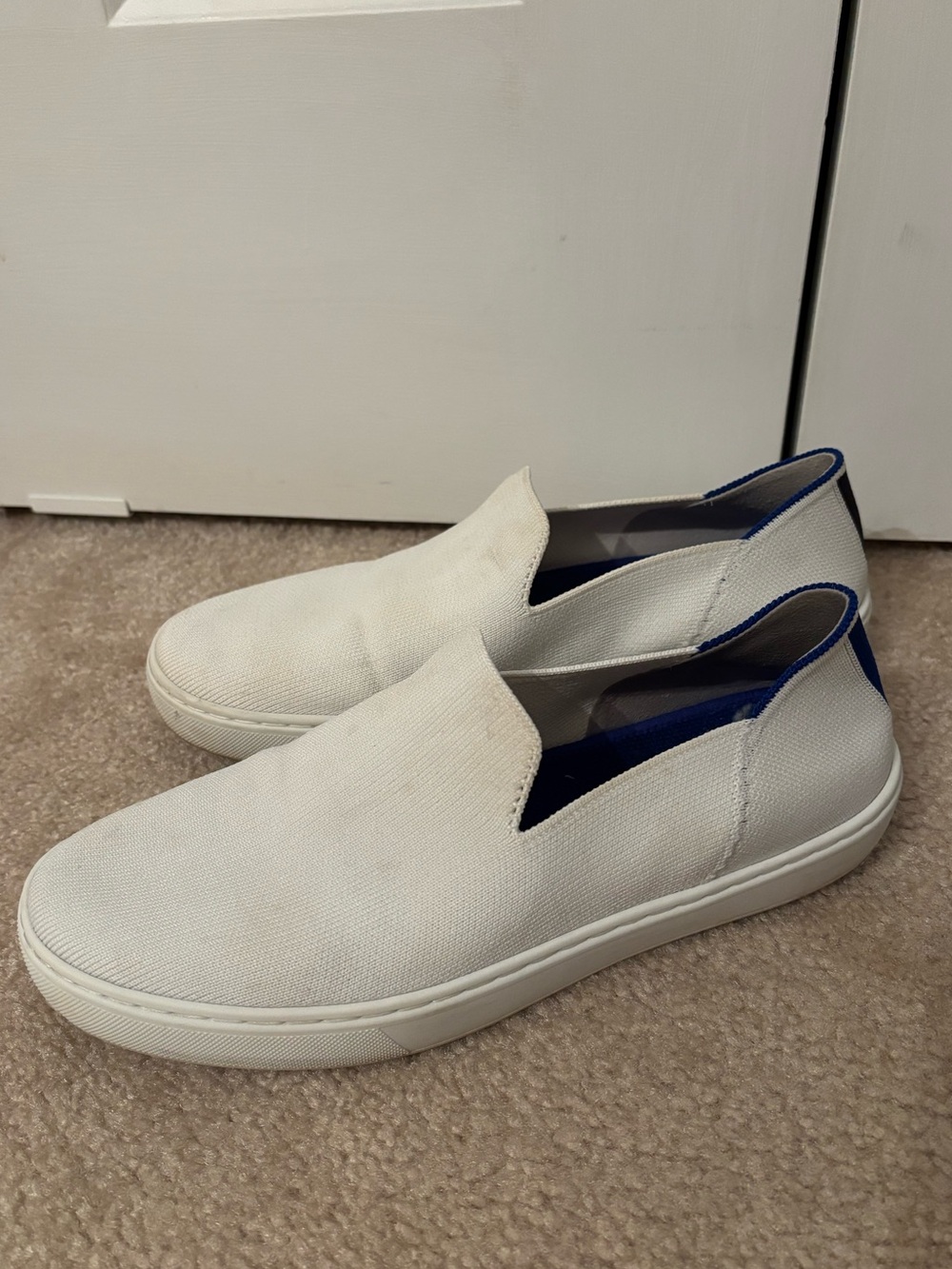 Rothy’s Slip-On Canvas Sneakers in White with Blue Trim